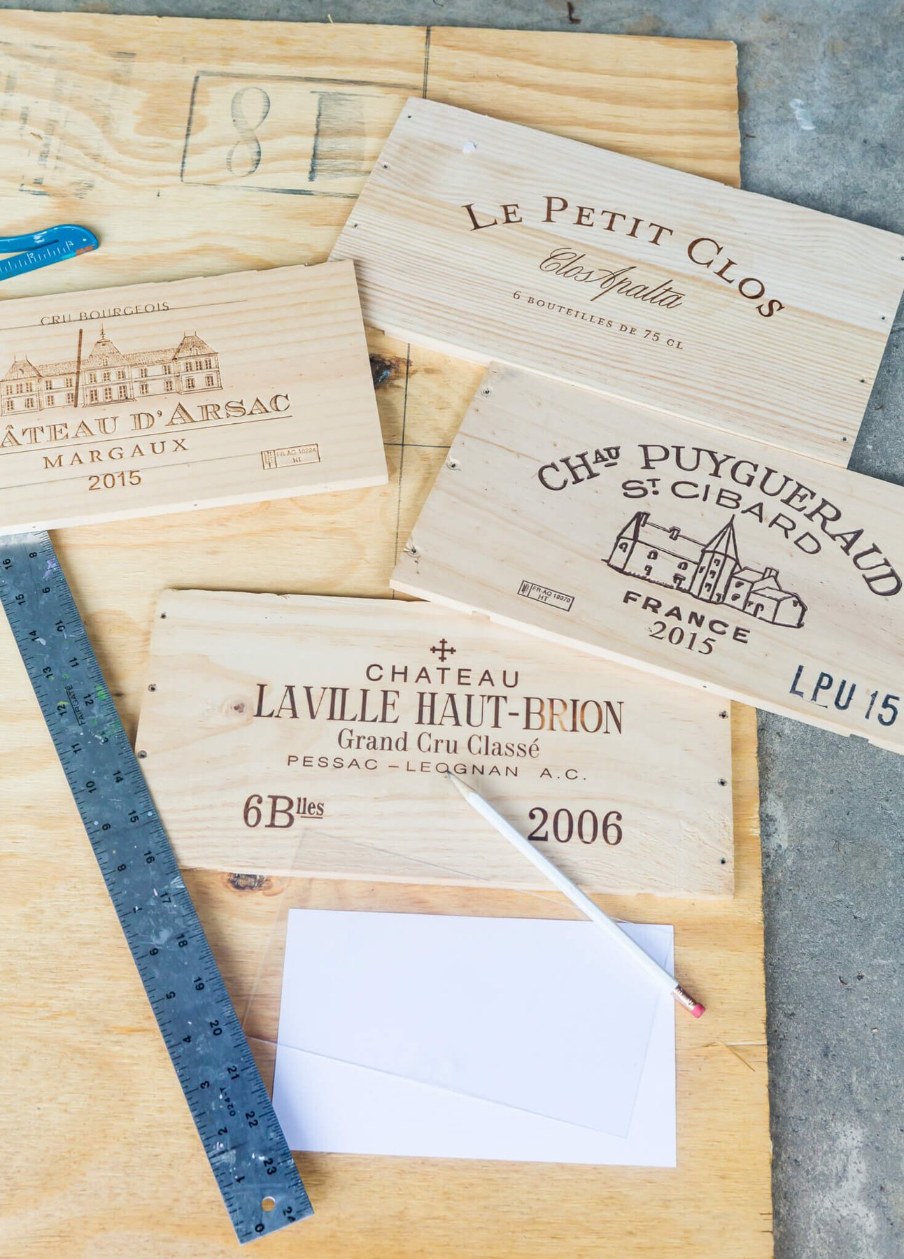 Plywood and wine crate fronts getting ready to be cut to make a custom recipe card box.