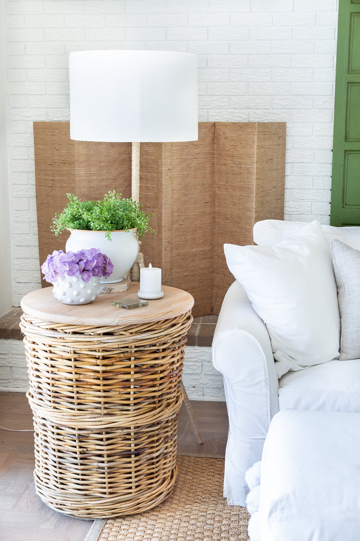Corner of easy breezy living room decorated for summer.