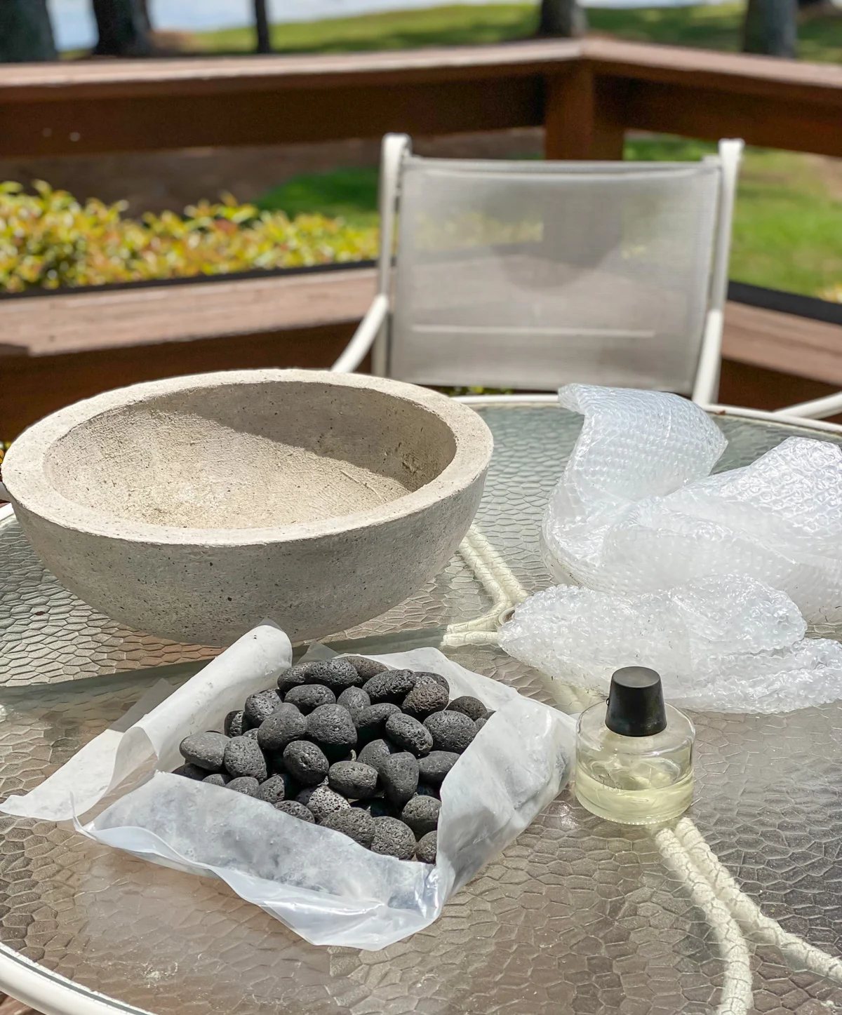 a large bowl, rocks or stones an a tabletop torch are what you need to assemble a DIY tabletop fire bowl.