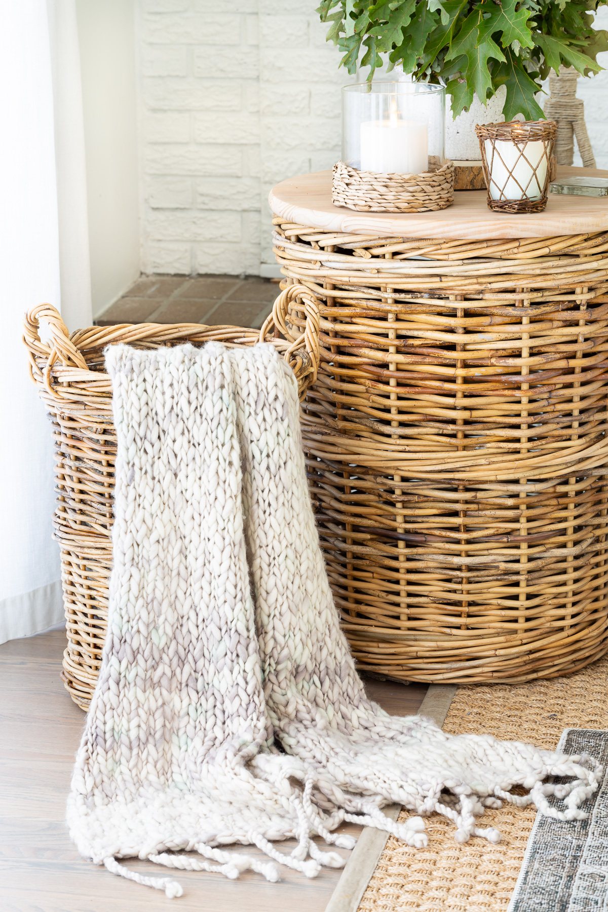 2 large baskets in living room. One is used as a side table, the smaller one as a place to keep a throw blanket out of the way, but handy when needed.