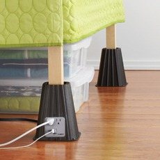 Dorm room bed risers with electrical outlets.