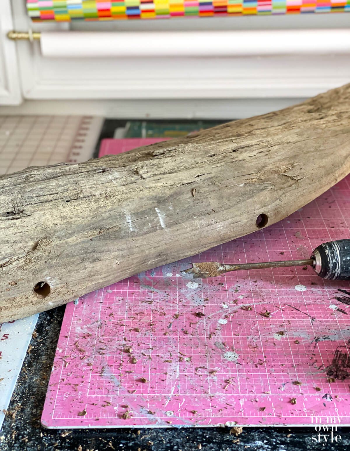 Drill holes in driftwood