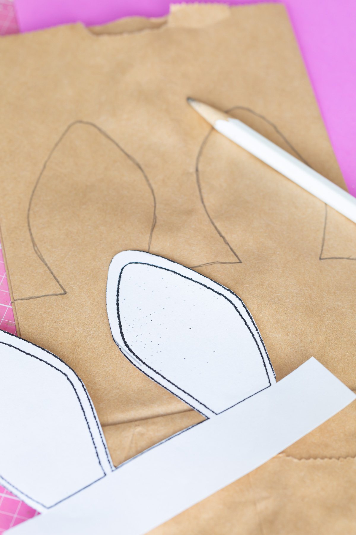 how to trace bunny ear template pattern on to brown lunch bag.