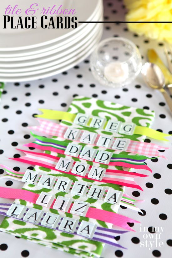 White and black glass tile letters glued on colorful ribbons to make table place cards.
