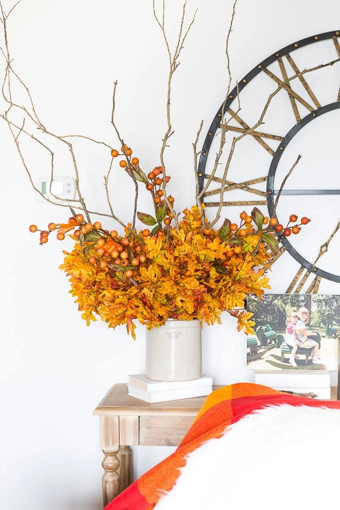 How to create a faux fall flower arrangement using branches from your yard and florals from the craft store.
