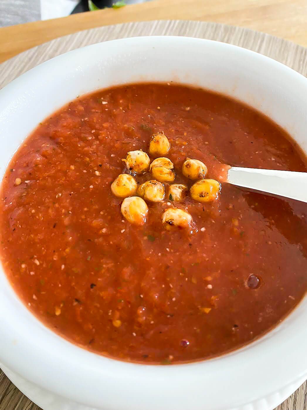 Chickpea croutons in a bowl of tomato soup