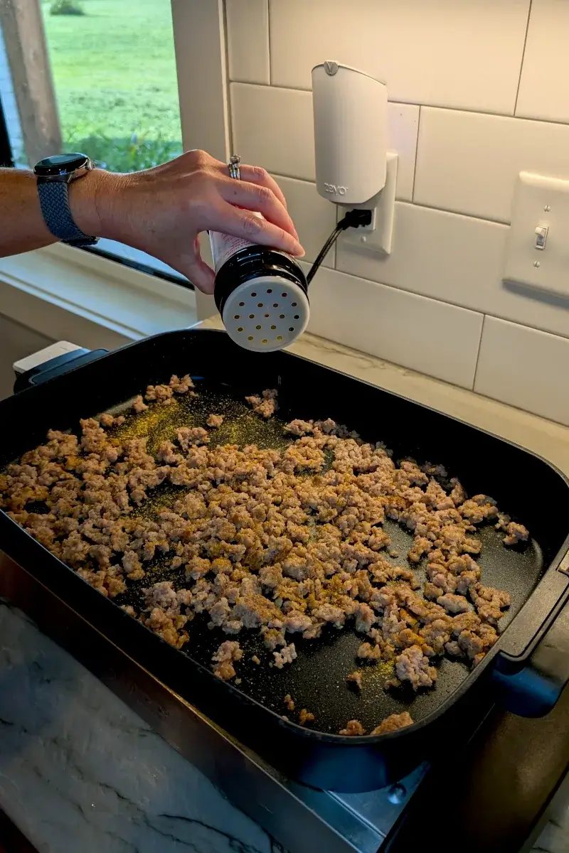 Seasoning the meat for shepherd's pie
