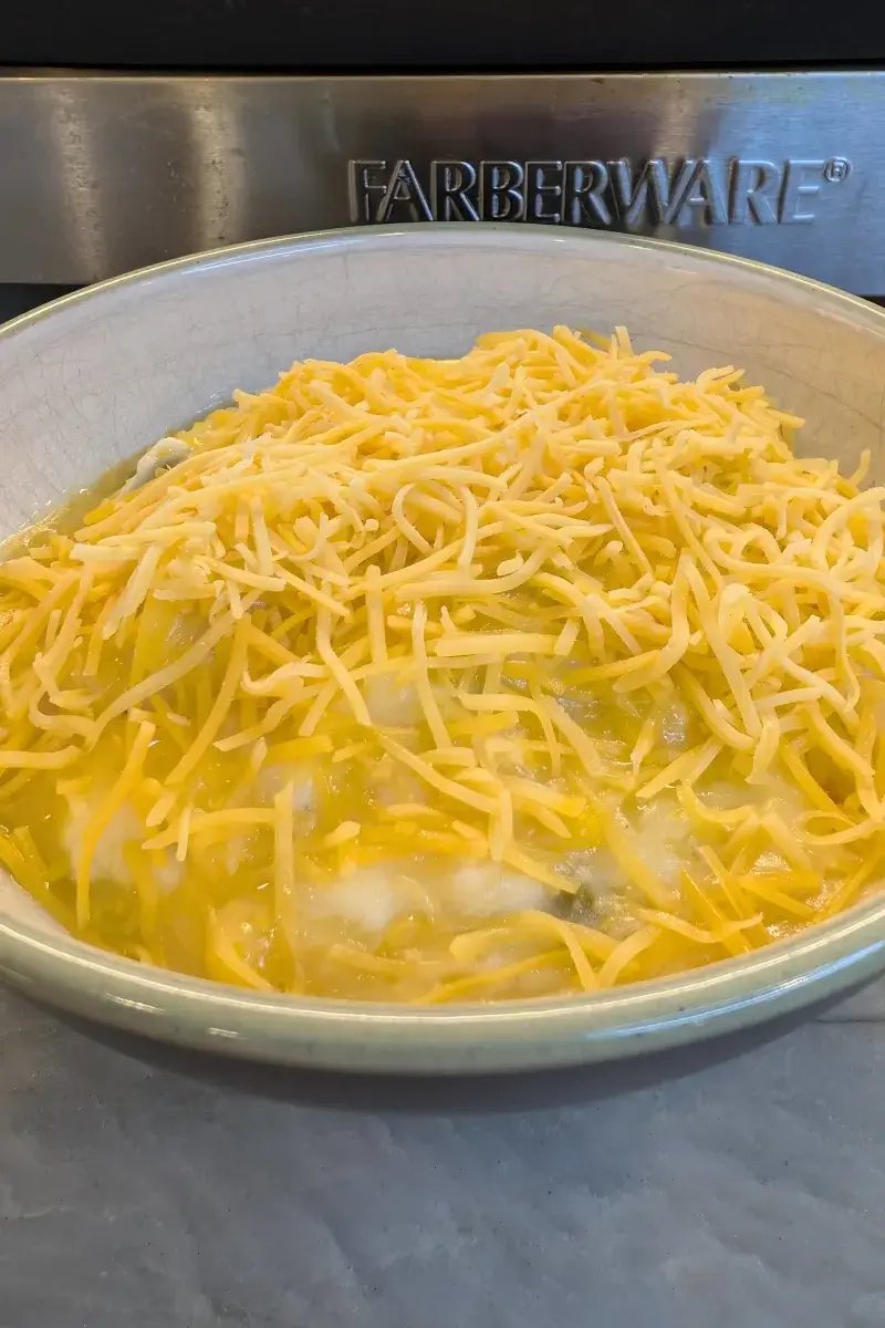 Shepherd's pie with shredded cheese in a bowl
