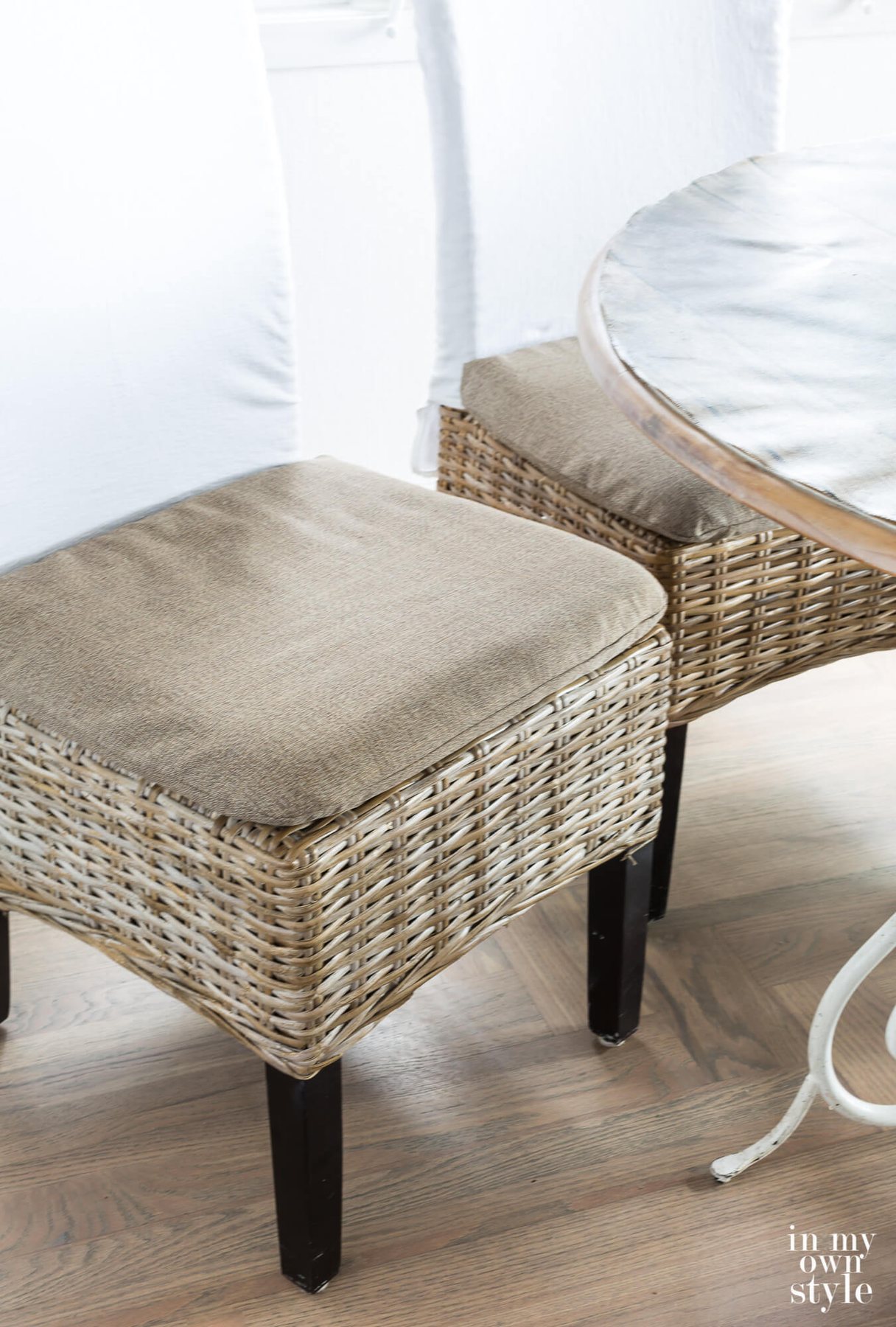 Driftwood colored rattan dining chair covers made by repurposing an item that was broken and headed for the trash.