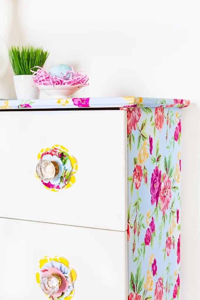 Spring home decor. Colorful flower fabric on furniture attached with liquid starch