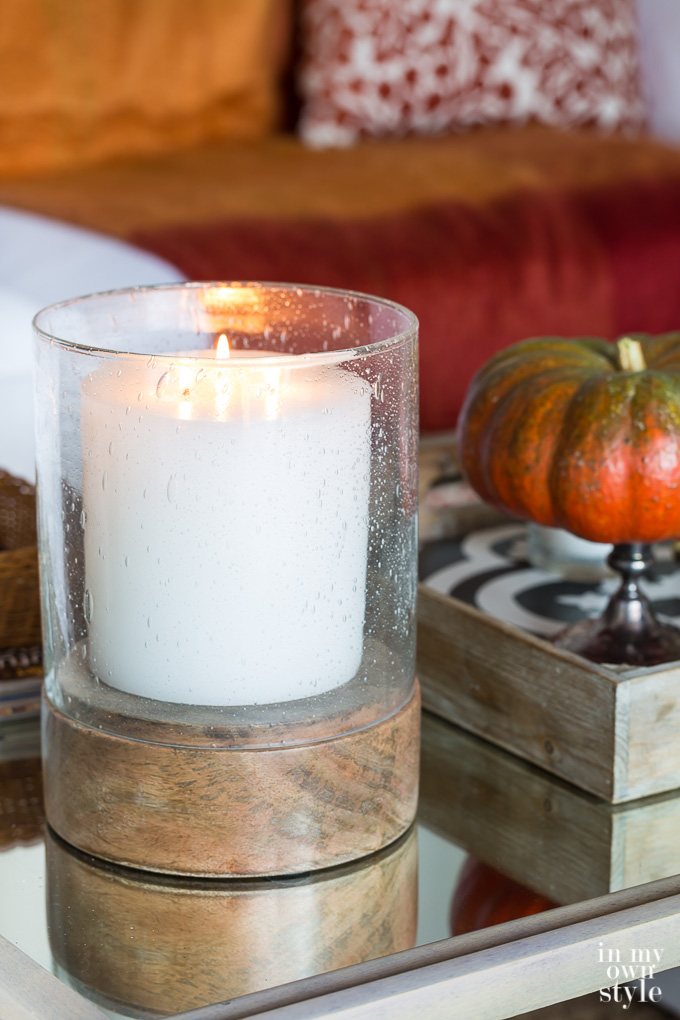 Bubble glass candle holder on table with white candle