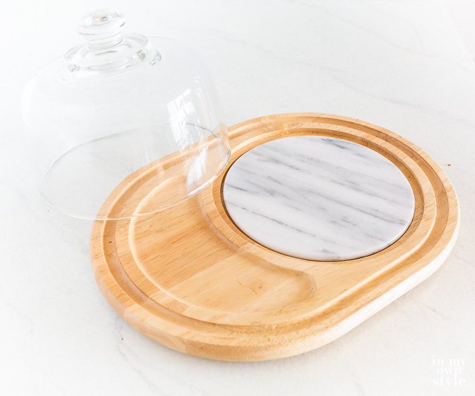 Thrift store cheese board to repurpose into a cake pedestal