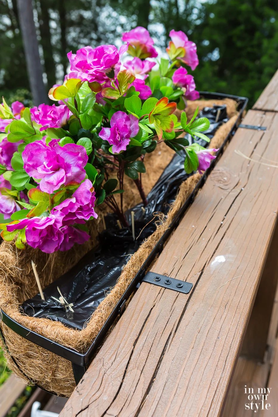 How do you anchor fake plants and flowers in a window box planter? Styrofoam.
