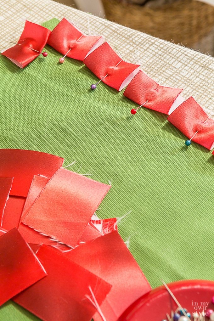 DIY pillow trim being made using ribbon
