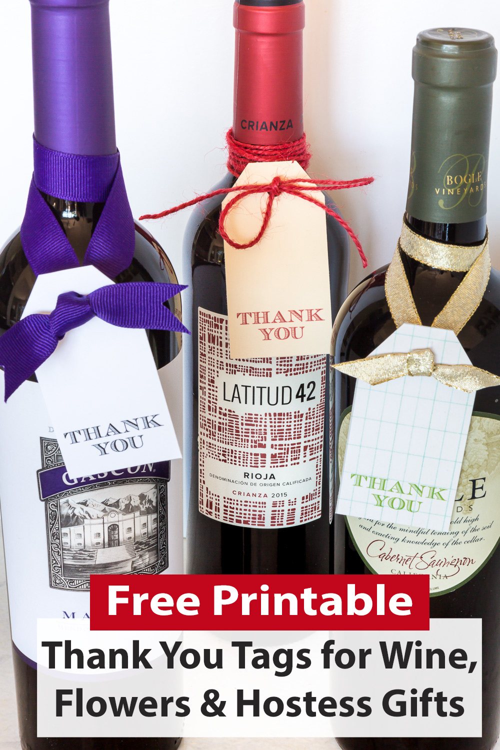 Free printable thank you tags tied onto 3 wine bottles to give as gifts or hostess gifts.
