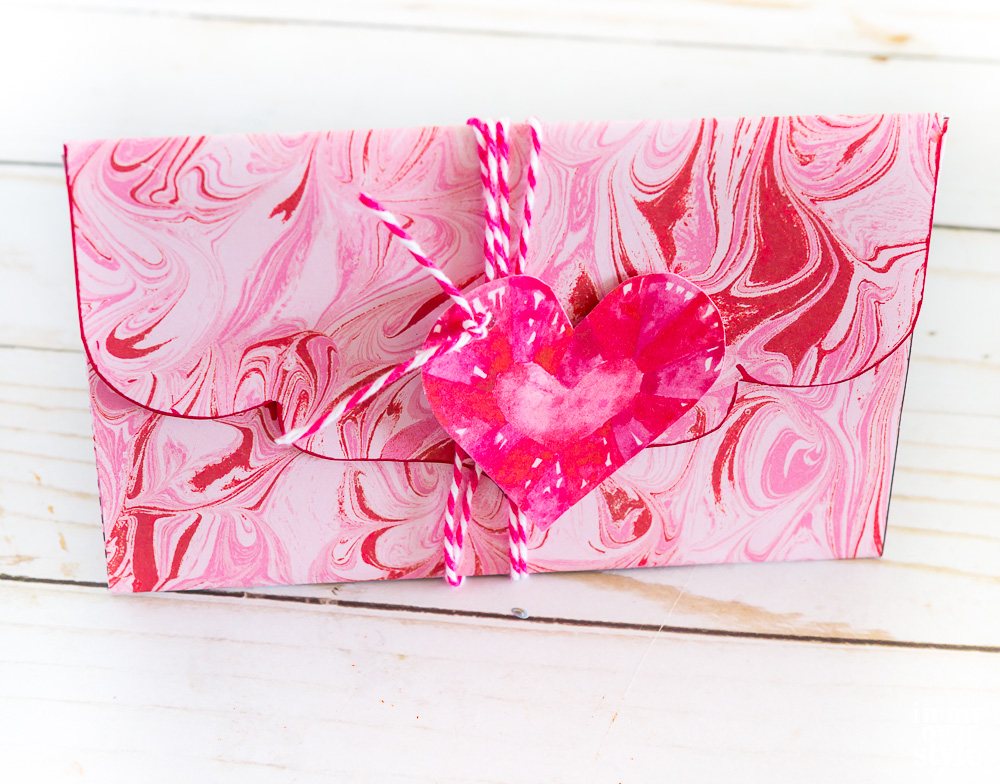 How to use scrapbook paper to make a Valentine envelope.
