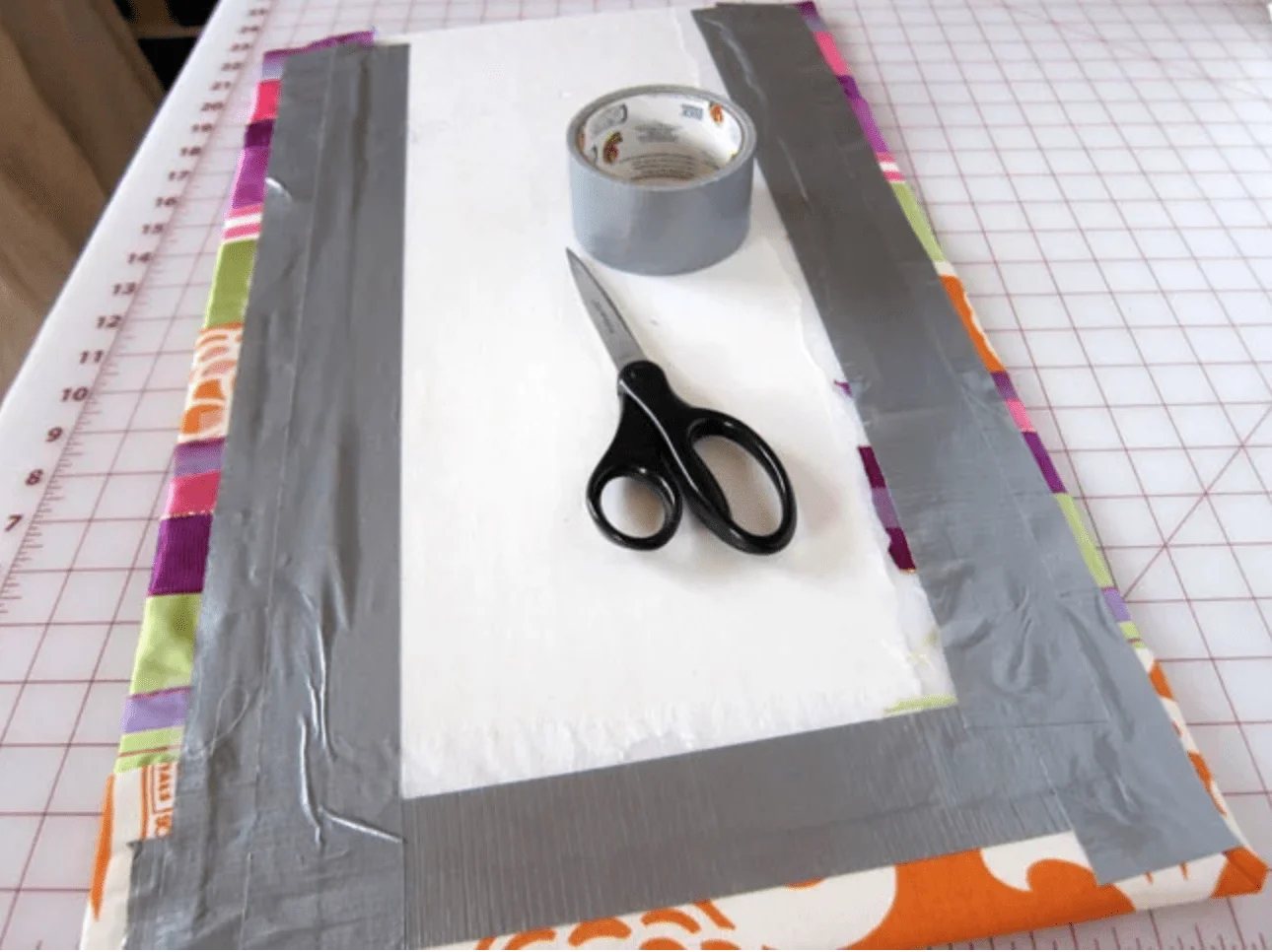 add duct tape to back of ribbon covered board
