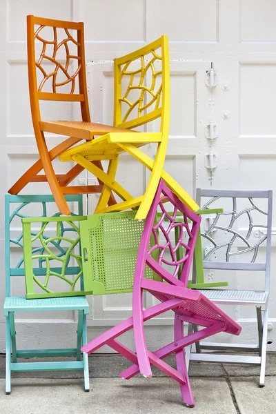 Colorful chairs stacked on each other