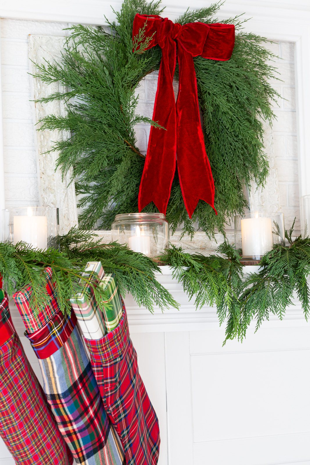 Red, green and plain decorated Christmas mantel.