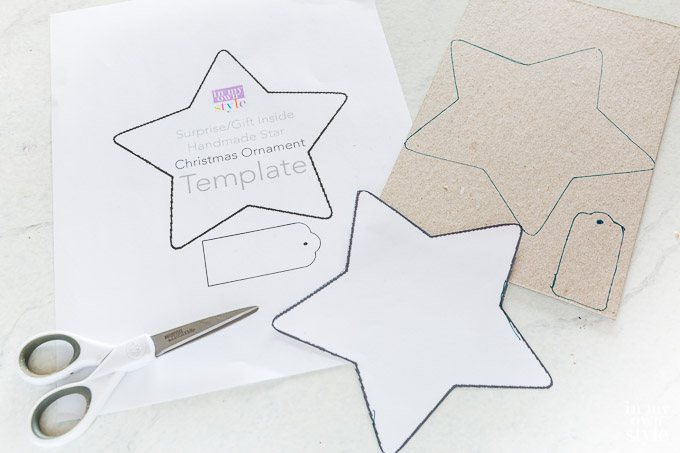 Cutting out the star template on paper.