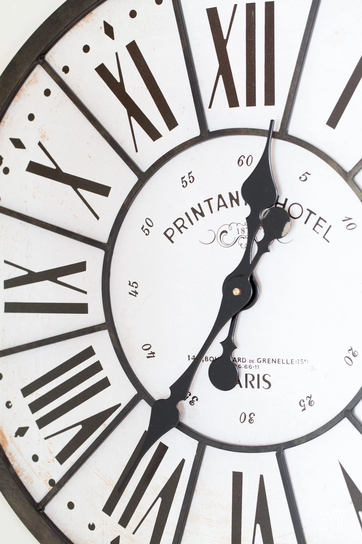 Oversized clock on wall hung on a wall with screw in wall anchors