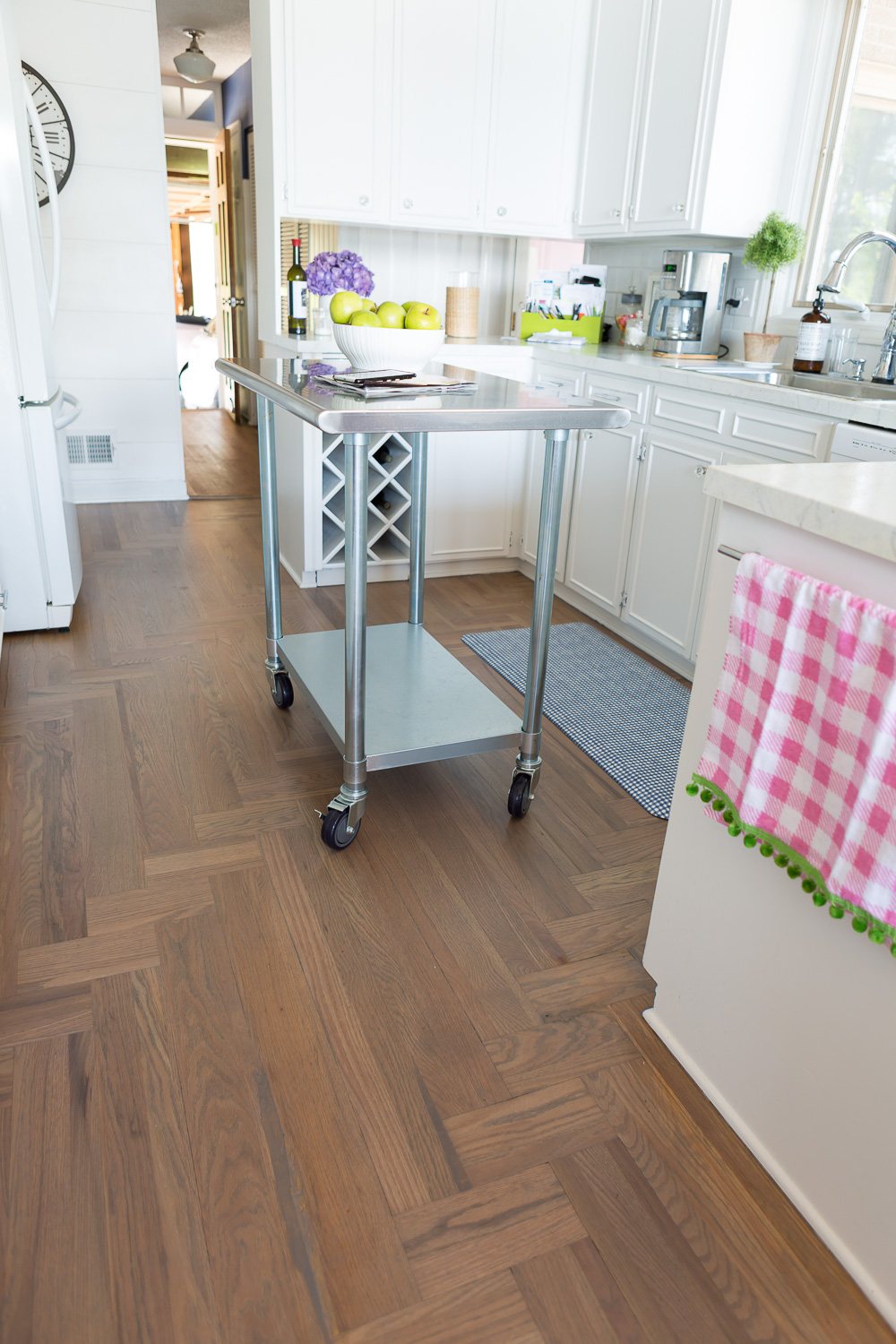 Kitchen showing newly refinished floor in the stain color Grey done by a Bona Certified Craftsman.