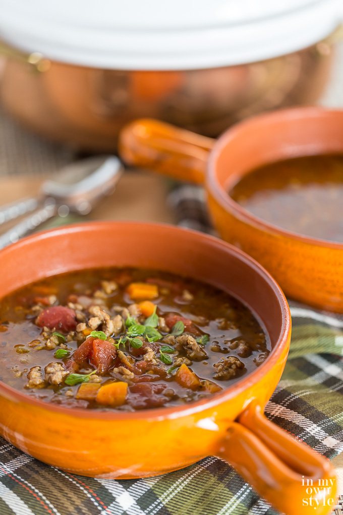 Sausage and Lentil Soup in orange bowl