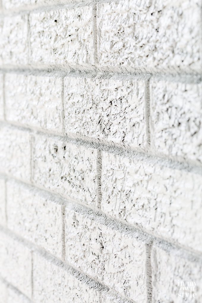 close up of white painted brick wall