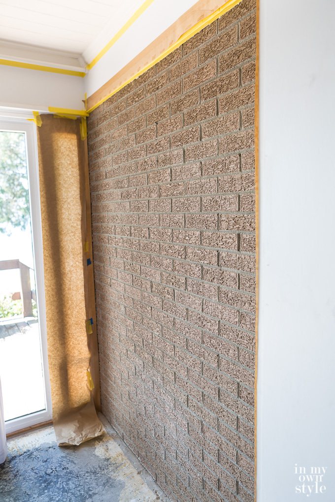 Textured brick wall about to be painted