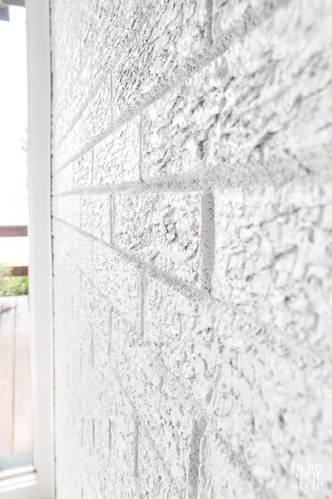 Close up of a white painted brick wall