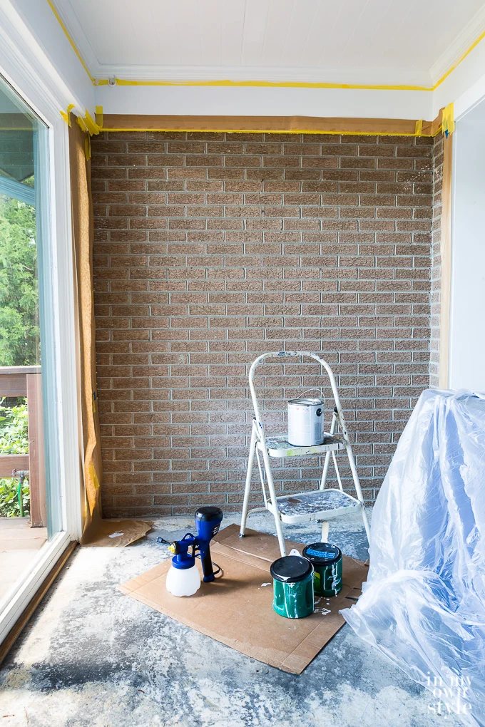 Rust colored textured brick wall Before being painted.