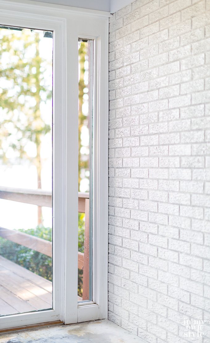 Window sidelight next to brick wall