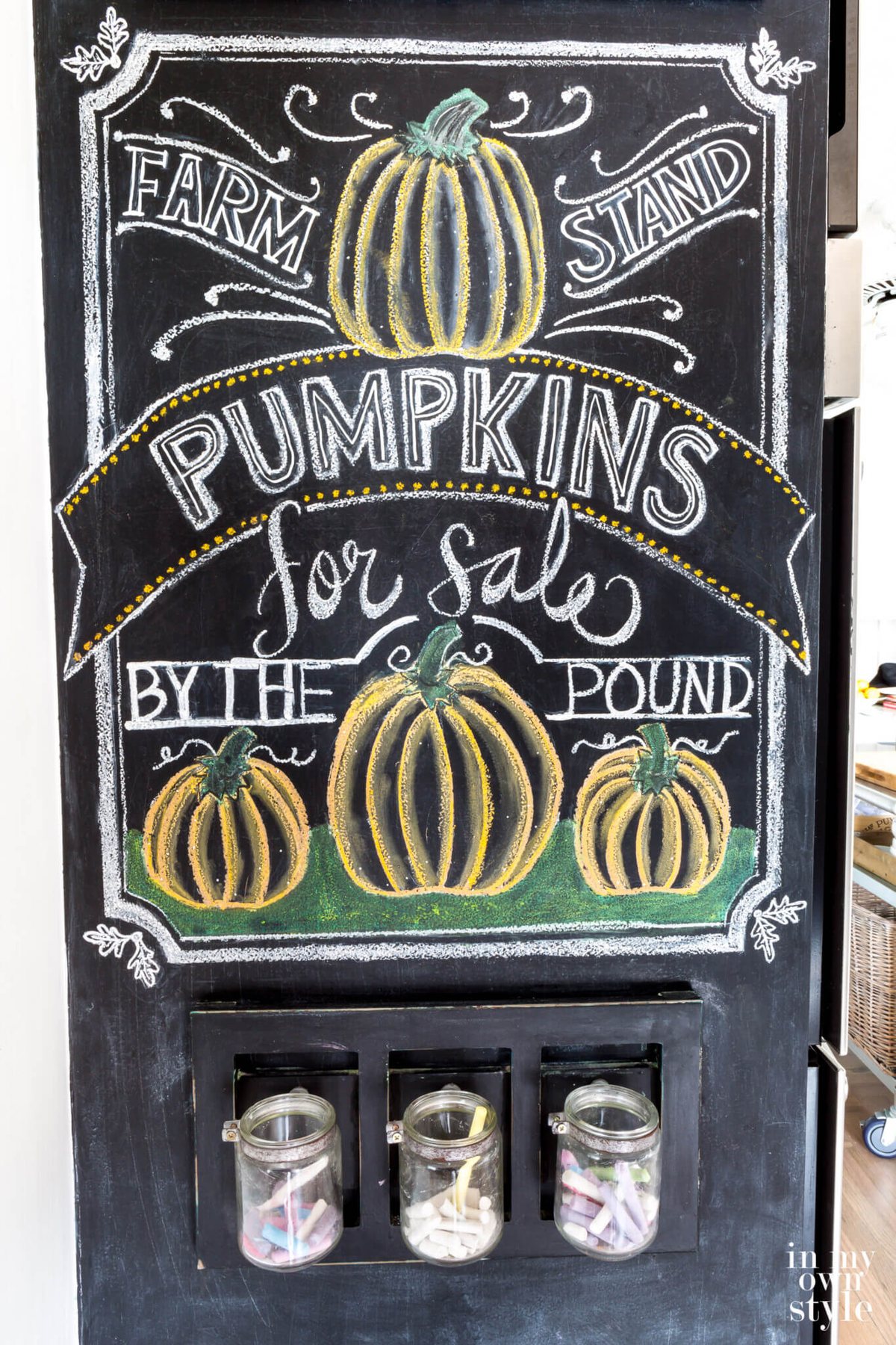 Fall Chalkboard art autumn pumpkins. close up shot of wall that says Farm Stand Pumpkins