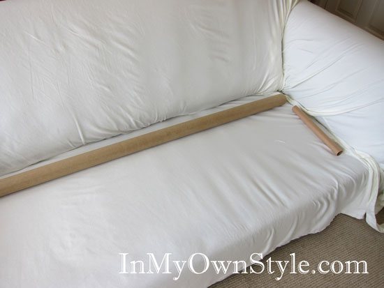 Use paper towel tubes to keep a sliocver from moving on a sofa or chair