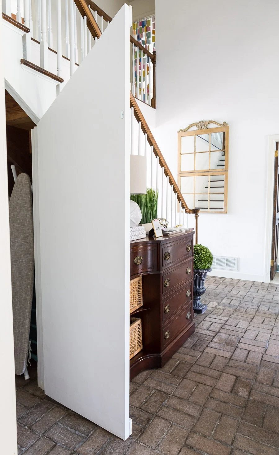 Angled hidden door under staircase closet
