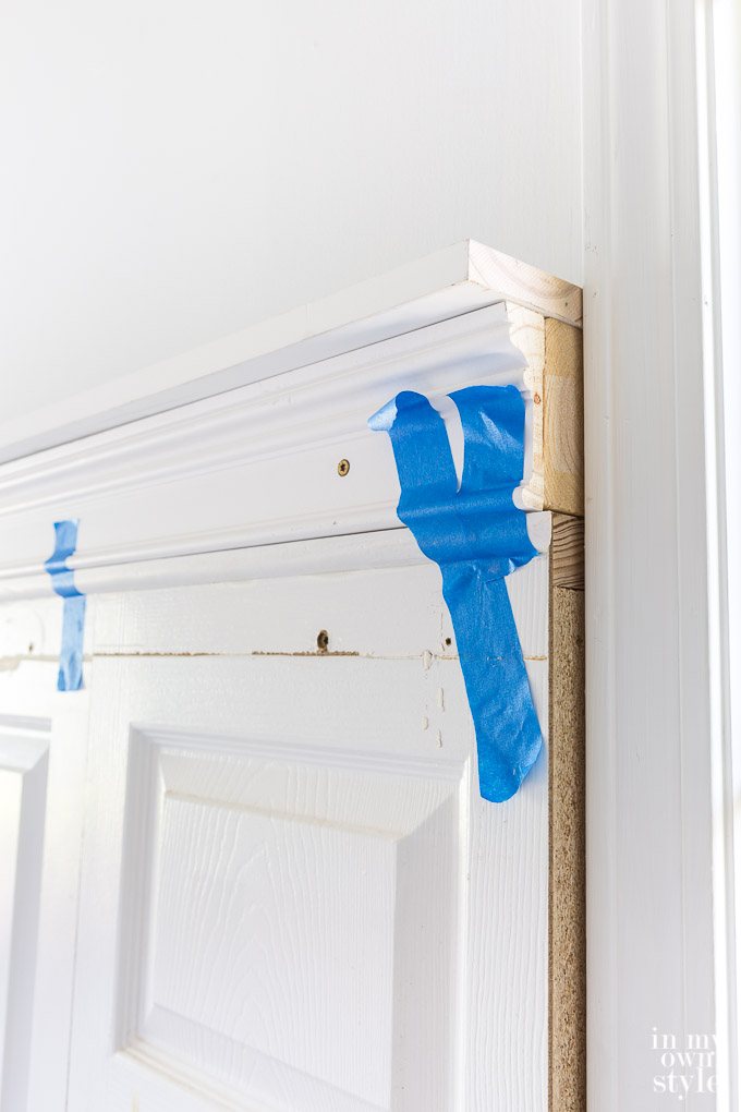 step by step photo tutorial showing how to make a headboard using old doors and wood molding