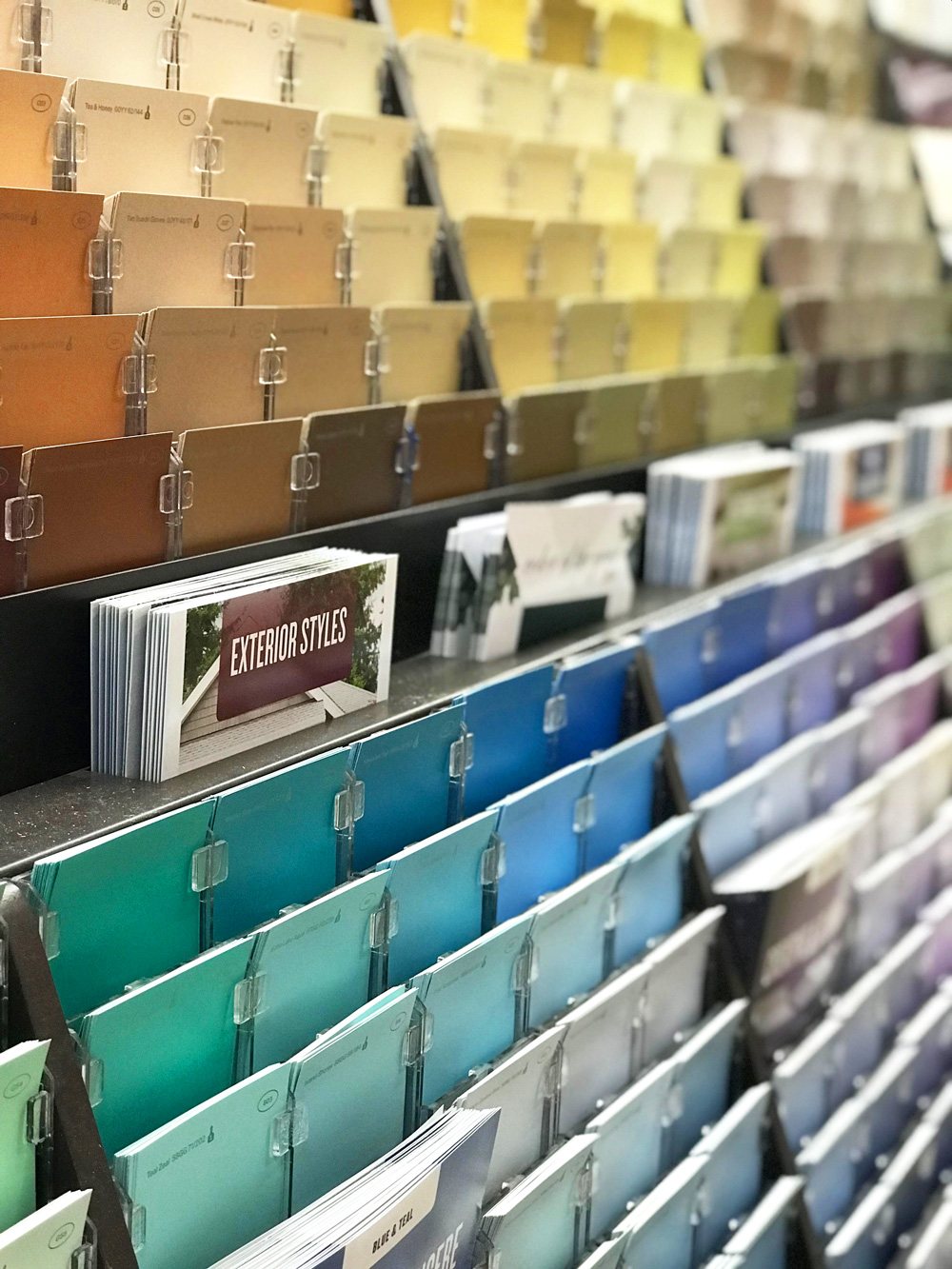 Wall display of Glidden PPG paint colors at Home Depot