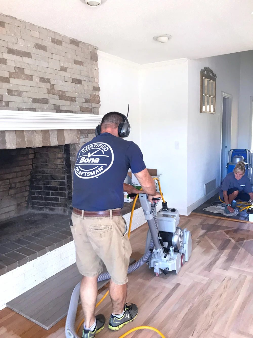 Bona Certified Craftsman sanding a hardwood floor