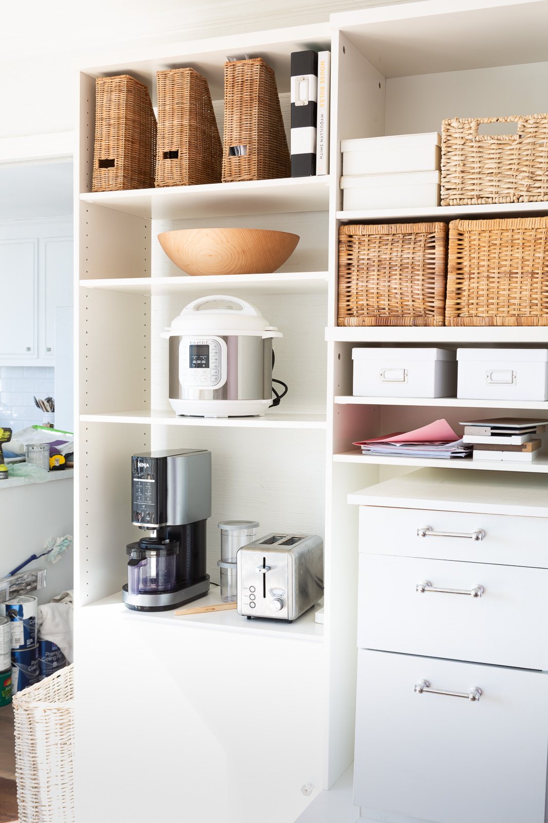 Vintage IKEA wall unit fitted to make a custom wall unit to act as a pantry using a mis-match of other storage items.