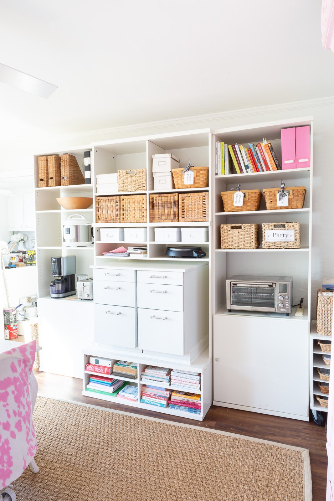 Vintage IKEA TV and media wall unit remade to use to hold a variety of kitchen, pantry and other items in a multi-purpose room.