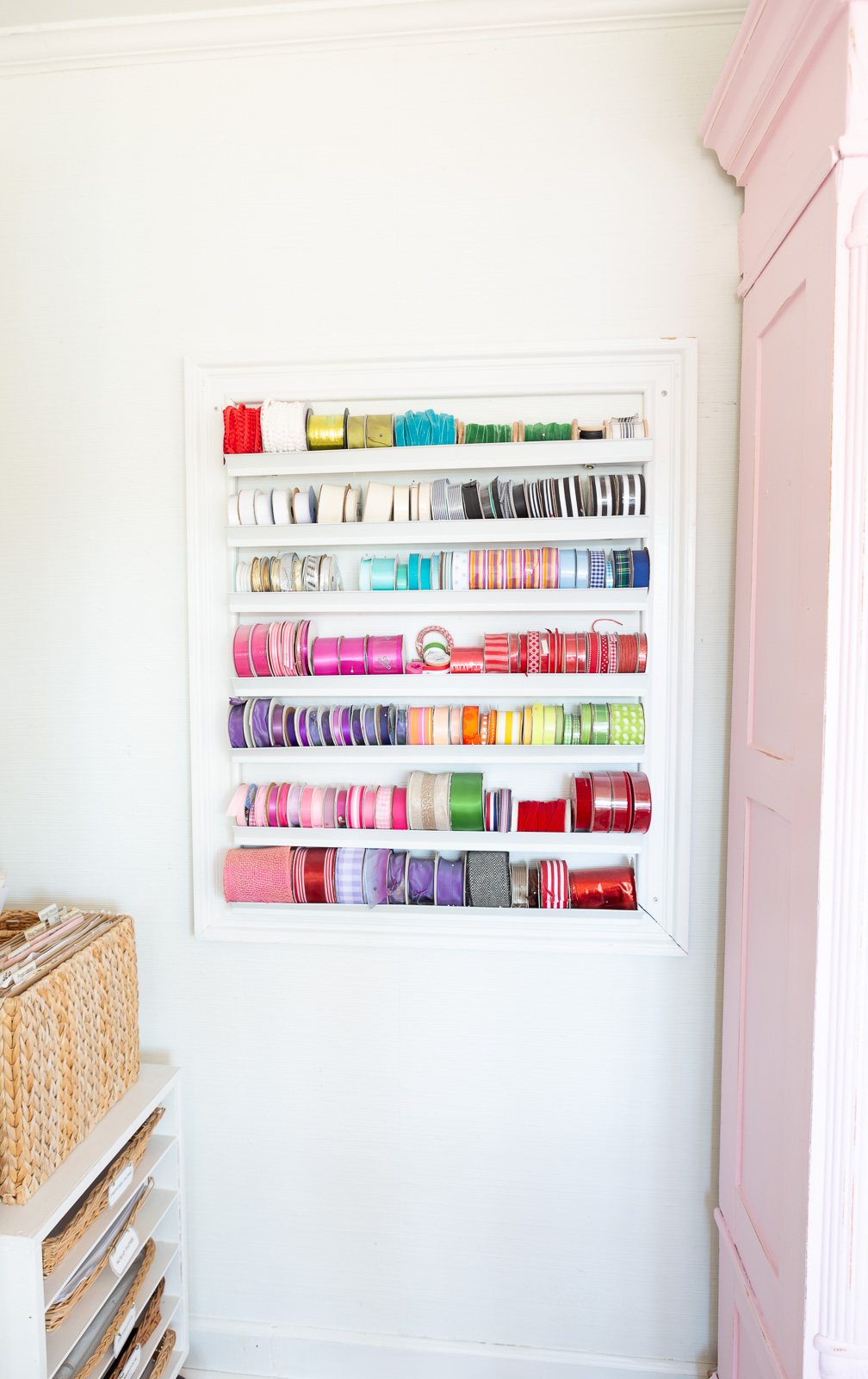 How to organize spools of ribbon in a craft room.