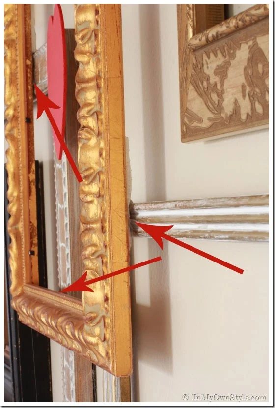 How to layer frames on a wall photo gallery