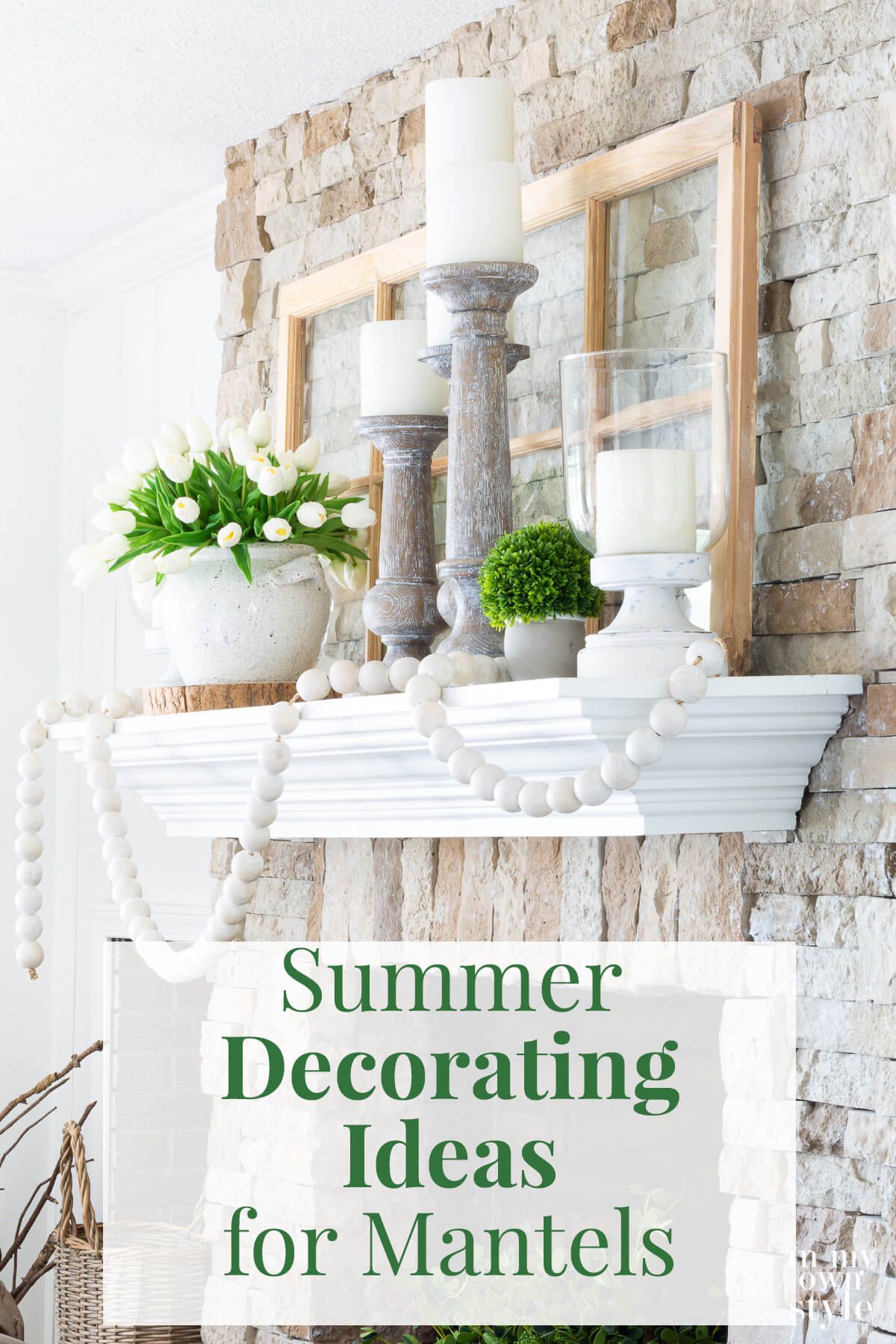 Green and white decorating color scheme on a fireplace mantel decorated for summer.