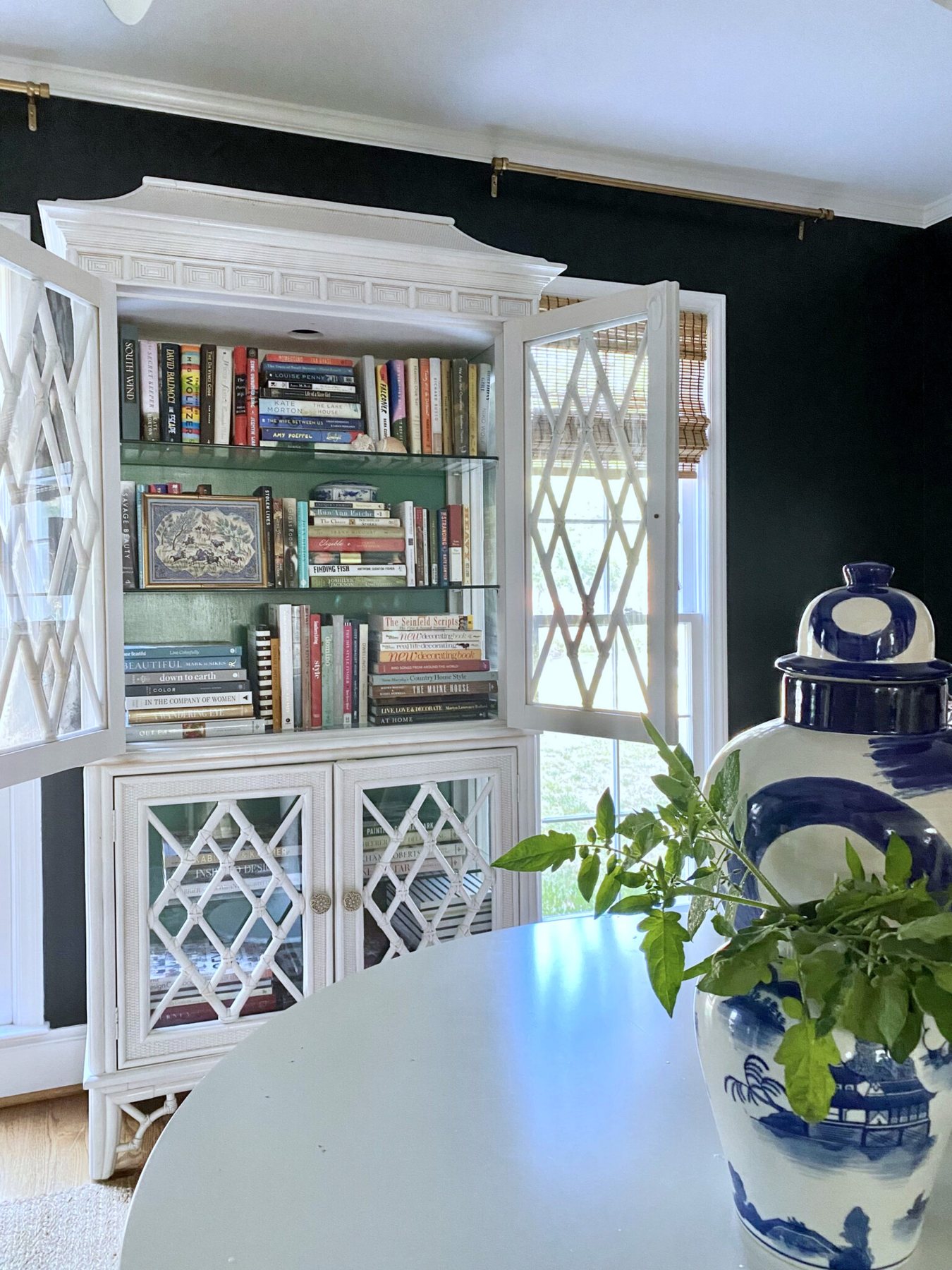 books styled in a china cabinet