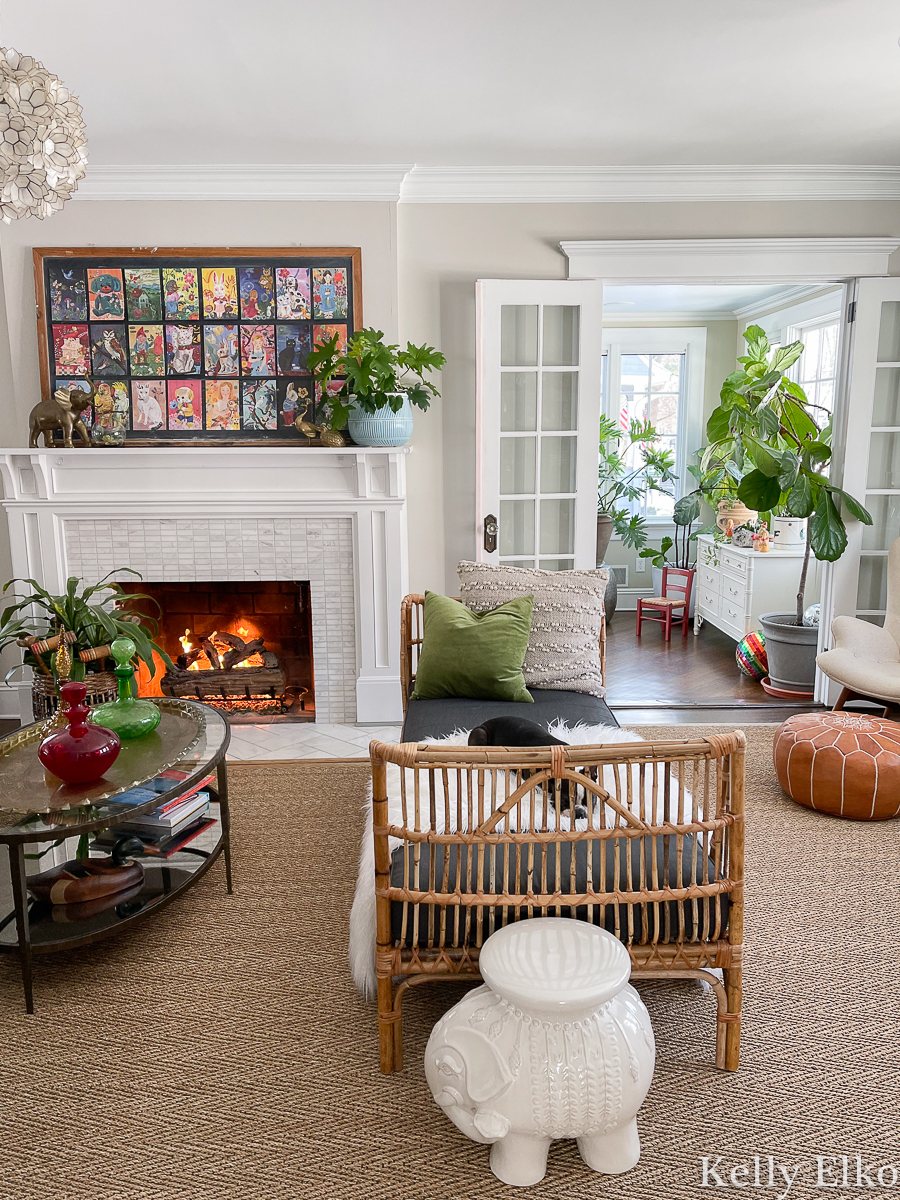 Kelly Elko's living room with eclectic-decor-rattan-colorful-art-plants.