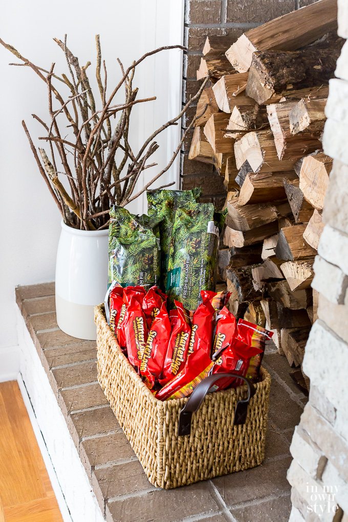Wood and firelogs stacked on a fireplace hearth
