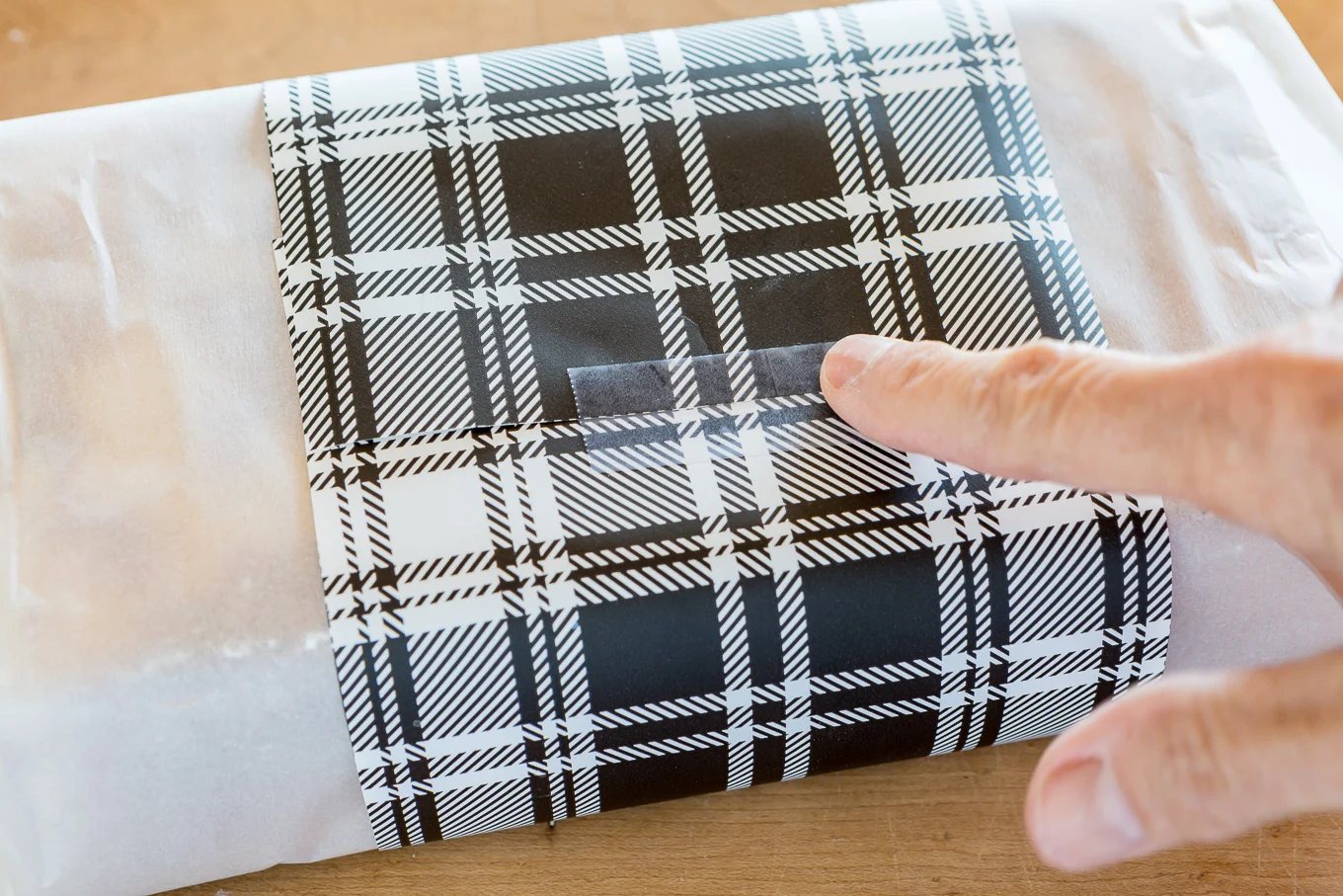 How to wrap a pound cake or loaf of bread with gift wrap to give as a hostess gift.
