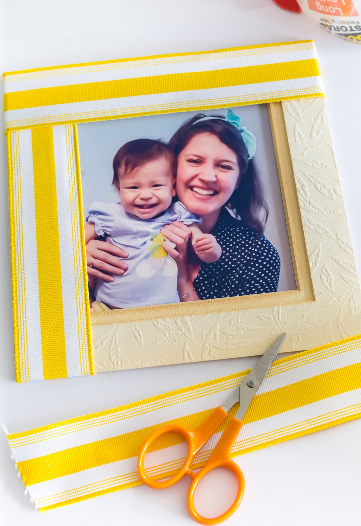 Yellow and white stripe ribbon scraps made into a picture frame mat.