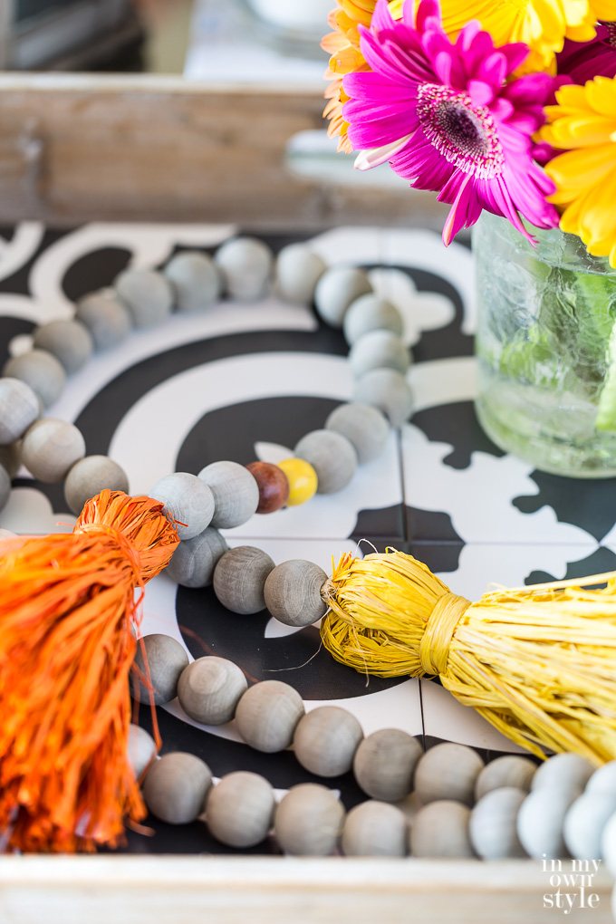 Wood bead driftwood stained garland with fall inspired colorful raffia tassels