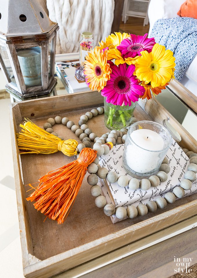 Tray on table decorated with a wood bead garland